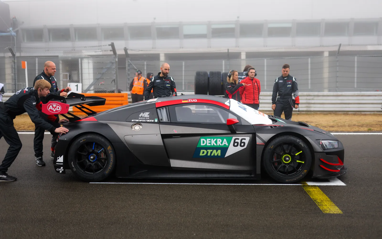 The crew pushes the Audi R8 LMS GT3 evo II onto the grid